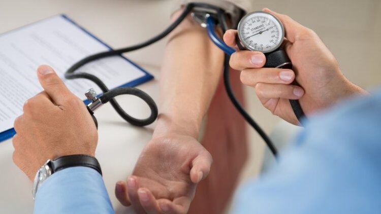 Close Up Of A Doctor Checking Blood Pressure Of A Patient